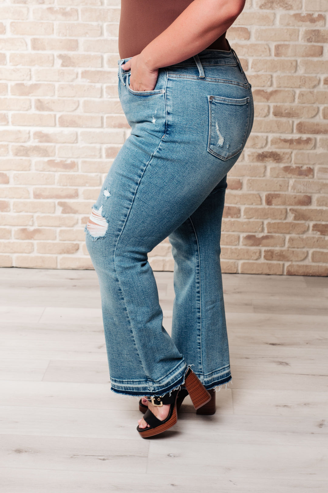 Isla Mid Rise Distressed Released Hem Bootcut Jeans by Judy Blue